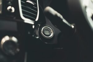 Close-up of a car Start Stop engine button in a modern vehicle interior.